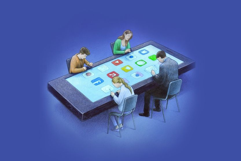 Grafika przedstawiająca czworo ludzi siedzących przed wielkim smartfonem imitującym stół